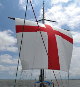 Sailing downwind driven by her square sail, Britannia rules the waves, at top.