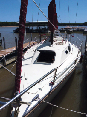 The hatch on the sloping forward end of the coachroof is well placed to catch the breeze. The sidedecks are wide, the foredeck is uncluttered, but the boat lacks toerails.