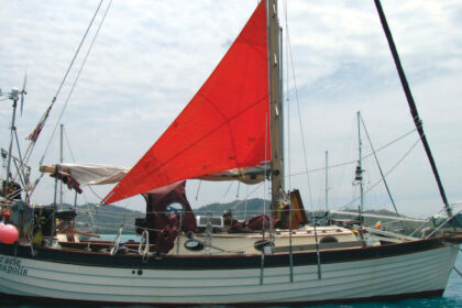 For reaching and downwind courses or for heaving-to, Ed and Ellen sheet the trysail off centerline using one sheet for each tack, top of page. The sheets must be long enough to cross over the boom. Lazy-jacks, if fitted, would require them to be longer.