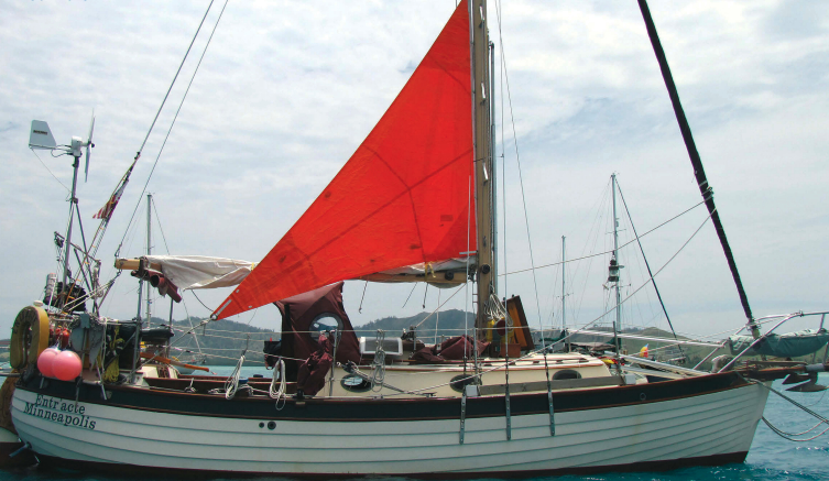 For reaching and downwind courses or for heaving-to, Ed and Ellen sheet the trysail off centerline using one sheet for each tack, top of page. The sheets must be long enough to cross over the boom. Lazy-jacks, if fitted, would require them to be longer.