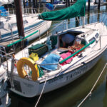 The boat Tackful anchored at dock
