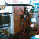 Cliff’s burp catcher, at the right in the photo, has been doing its job of trapping diesel fuel. The dryer, at the left, is between the burp catcher and the vent in the transom.