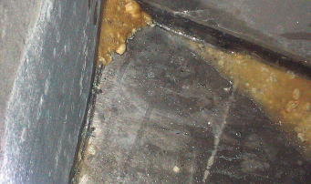 After cutting inspection holes in the tank top, Alan saw signs of corrosion. Cutting off the top revealed more evidence.