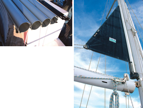 Handling the mainsail and mizzen was a bit much for a couple, so Vic fitted behind-the-mast furling systems. They came in many boxes, far left, and though a labor to install, eventually proved their worth, at left.