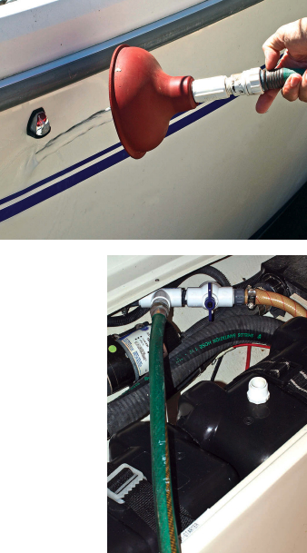 Clarence modified a plumber’s sink plunger so he can connect a garden hose to it and back-flush his holding tank’s vent system, at right. The valve in the line, below right, is normally open. Closing it prevents the back-flush water from going into the holding tank and a hose on the tee directs the water to a bucket.