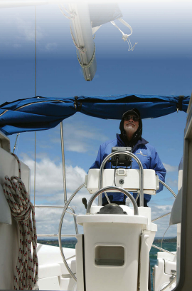 The portrait of a happy man. As captain, Jerry Powlas, at left, was generous about sharing the helm but, just like at home, he was happiest when taking in the sights from this spot.