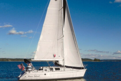 Jim and Jessica McCann sail their trendsetting Beneteau First 32s5, Down Island, on lakes in Kentucky and Tennessee, above.