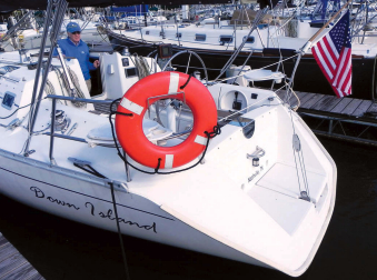 The sugar scoop transom, at right, provides a more convenient way to board the boat from the water or a dinghy than does a conventional transom.