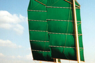 Annie Hill and Trevor Robertson sail Badger off Falmouth, England, at the beginning of a cruise that lasted many years and covered many miles and instilled in Annie the love for the junk rig that she harbors to this day.