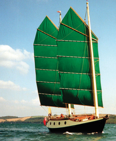 Annie Hill and Trevor Robertson sail Badger off Falmouth, England, at the beginning of a cruise that lasted many years and covered many miles and instilled in Annie the love for the junk rig that she harbors to this day.