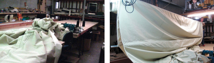 As the sail grew in size, Annie found herself shoving ever larger bundles of assembled fabric across the table as she sewed, at left. When she had completed most of the sewing, she suspended the sail from the boom, at right, to check her handiwork. The material is used for awnings.