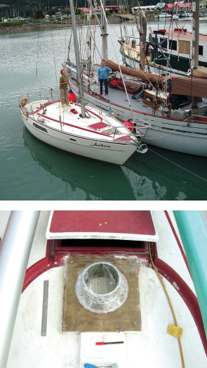 A friend with a large ketch helped Annie pull the old mast out of the boat, at right. The unstayed junk mast puts a lot of load on its partners, which must be built strongly and well supported, below.