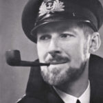 Before he turned to building boats, Denys Rayner enjoyed a long and distinguished career in Britain’s Royal Naval Volunteer Reserve during World War II. His experiences formed the basis for several books, including the novel and movie, The Enemy Below.
