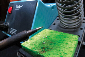 Tinning the tip of the soldering iron is crucial to making good solder joints. The sponge, kept damp, is used for cleaning the tip.
