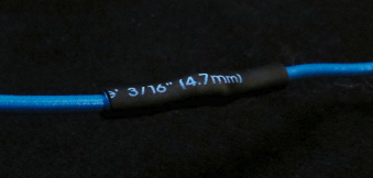 To ensure a waterproof seal on the insulation, the heat-shrink tubing should extend at least 1⁄4 inch either side of the bare wires.