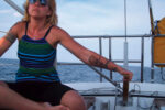 Once she discovered sailing, Lisa, here at the helm of Escape, found it brought back fond memories of time spent on the water with her father.