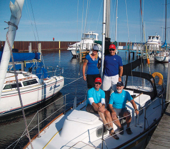 Escape placed second in the 2013 M&M Yacht Club 100-Miler race with (clockwise from top left) Lisa, Rick Georgeson, Curt, and Kevin.