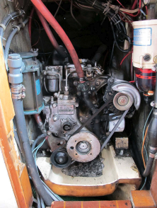 The engine is behind the companionway ladder, at right. Access to it can also be had from the galley and from a cockpit hatch.