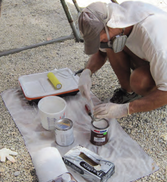 Chris and Anne laid out all their supplies in an orderly manner to ensure they would have no untimely delays while painting. Chris always wore a respirator rated for organic vapors while working with the primer and topcoat.