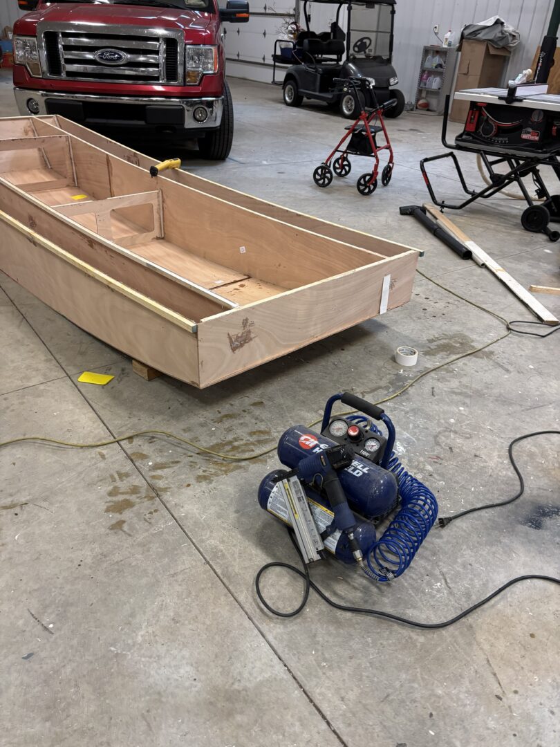 Nail gun with stainless brads to "baste" it all before glue fillets. The walker in the background is much used.
