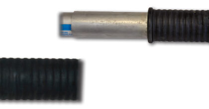 David took a standard West Marine boathook and extended it with a 6-inch length of aluminum tubing, above. (The fasteners are under the rubber grip.) He epoxied a Forespar Lexan snap-on mast hook into the end of the tubing.
