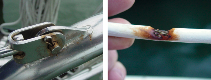 A stress crack and some corrosion are visible at the base of the lifeline-attachment eye where it’s welded to the pulpit, at left. Also, the cotter pin looks loose and could fall out if the clevis pin it’s securing rotates over time due to vibration. Where a vinyl-coated lifeline passes through a stanchion, the coating can chafe away, at right, creating a path for water to enter the wire and initiate corrosion.