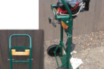 The outboard clamps to a 2 x 4 that’s notched so the motor’s bracket clears the truck’s crossbar. David fastened the board with a lag bolt at each end through the truck frame. The metal plate extends the truck’s foot to prevent the rig from tipping.