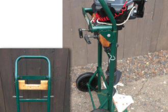 The outboard clamps to a 2 x 4 that’s notched so the motor’s bracket clears the truck’s crossbar. David fastened the board with a lag bolt at each end through the truck frame. The metal plate extends the truck’s foot to prevent the rig from tipping.