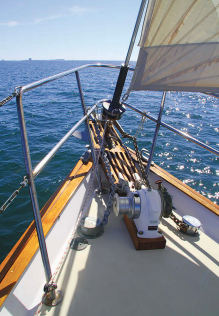 The high bulwarks provide secure footing for crew tending the ground tackle. The bow platform creates maneuvering room but must be supported with a strut if it is to properly handle heavy loads on the rode.
