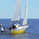 A view from the quarter shows the marked flare toward the bow that created a broad foredeck on the narrow hull.
