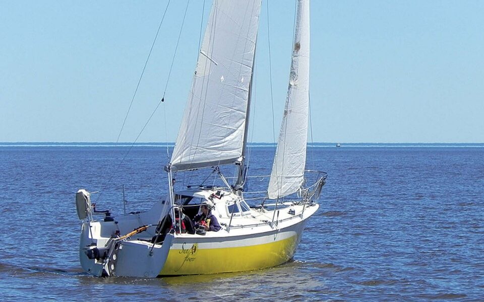 A view from the quarter shows the marked flare toward the bow that created a broad foredeck on the narrow hull.