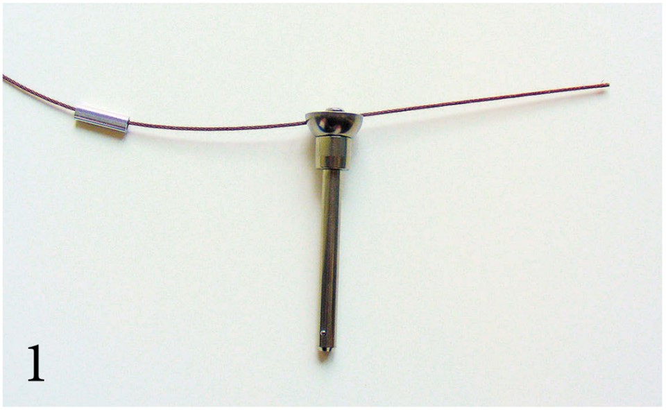 To make a tether, start by passing the leader wire through a sleeve and then through the tether hole in the Ball-Lok pin (PHOTO 1).