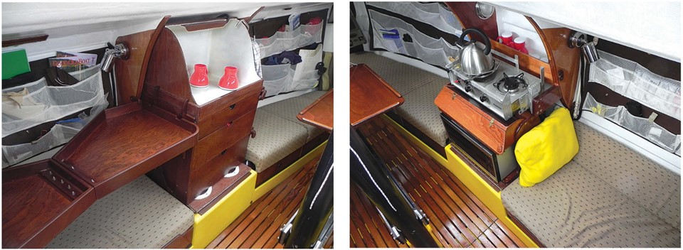 As a raceboat, the Mega 30 was originally fitted with a minimal galley. Among the modifications Jerry made were the foldaway counter and “spray booth,” at left, where he and Karen rinse dishes with a handheld pressure washer. The booth doubles as a countertop. On the starboard side, the galley has just enough space for a two-burner stovetop with microwave oven beneath it, at right. The keel trunk is in the middle.
