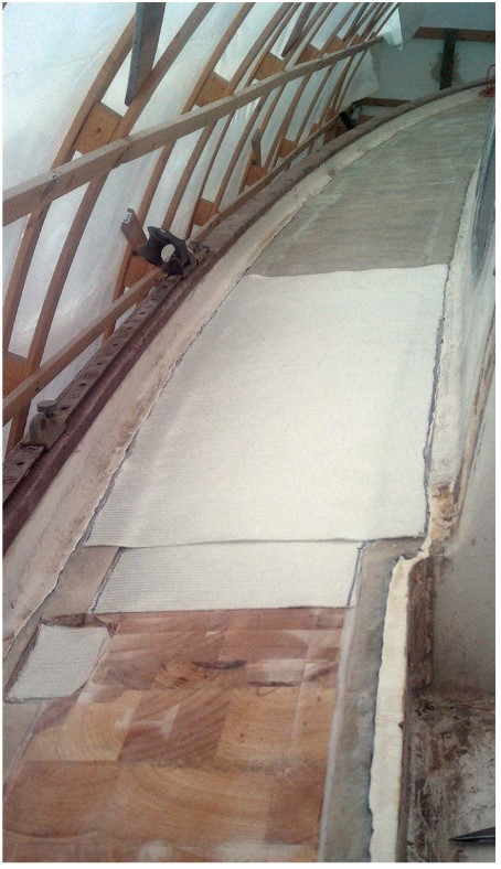 First, though, Matt laminated the small pieces of cloth in place of the core in areas where stanchions and other fittings would be located. This will prevent water intrusion in the future.