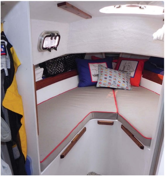 With the head on the starboard side, that side of the V-berth is shorter (5 feet 9 inches) than the port side (6 feet 6 inches).