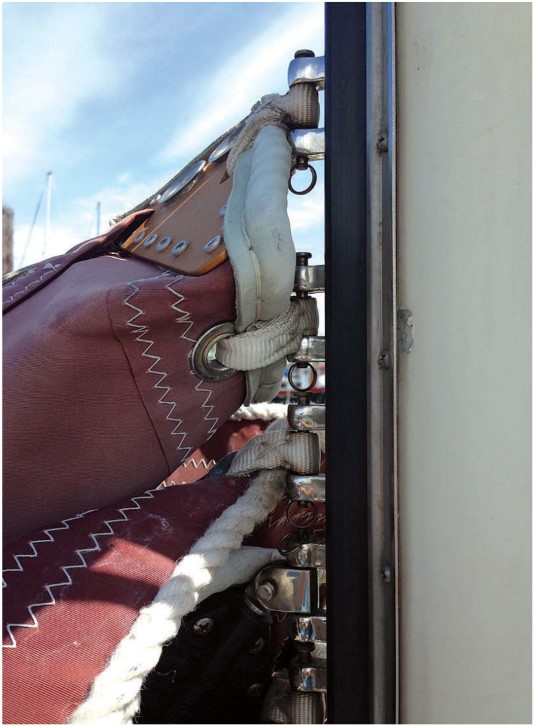 A mainsail that doesn’t raise or lower freely due to jammed slugs or slides can be a safety issue. A sail-track system with batten cars is slick enough to allow the sail to be reefed off the wind.