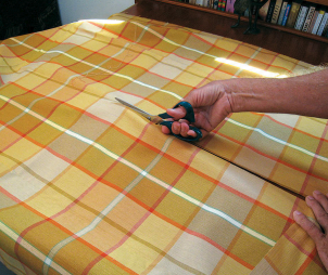 Positioning the hems for seaming the sides is confusing, so be sure you have it right before sewing the side seams. Use the diagrams at left for guidance. A straight pattern with a plaid or stripes makes accurate cutting easy, above.