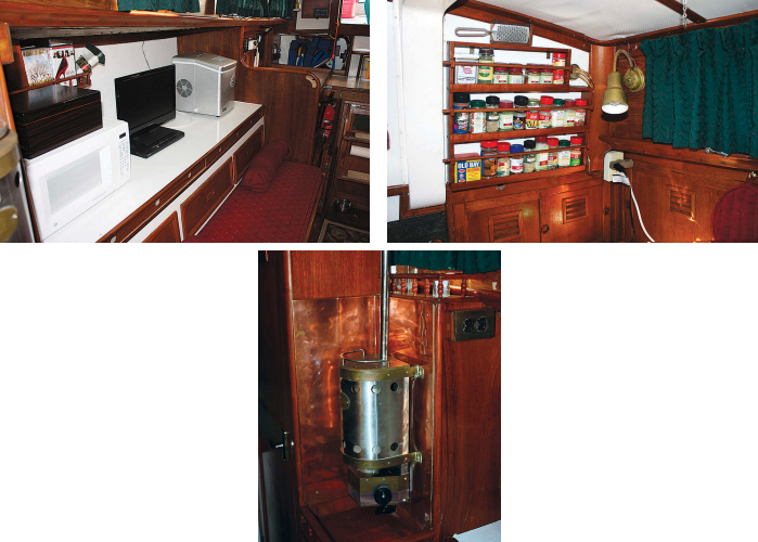 Originally a pilot berth, a large shelf area on the starboard side now holds the liveaboard home comforts of a microwave and an icemaker, at left. Just under the shelf, Ron built a narrow locker where they store paper charts flat. Ron also made the spice rack, at right. The Force 10 propane heater, below, is the right size to warm the cabin on chilly evenings at anchor.