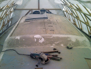 Grinding the deck-edge bevels was a noisy, dirty job. By the time Matt was done, dust covered absolutely everything in the shed.