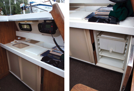 With the pop-top raised, there’s standing headroom at the sideboard galley, far left. Representative of the many clever features incorporated into the Rhodes 22 over the years is an icebox with a spigot to drain off cold water as the ice melts, at left.