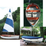 “Simpy elegant” describes the Oxford Dinghy, on facing page, and it’s not hard to understand how even non-sailors would be drawn to it, especially upon seeing the richly varnished woodwork, at right. With its trailer, it’s ready to sail on any inviting patch of water, below.