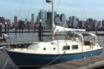 The Freedom Tower was still under construction when Roger’s son Justin took this photo of Bucket from Newport, New Jersey, with the Manhattan skyline in the background. Bucket is a Westerly Chieftain.