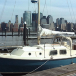 The Freedom Tower was still under construction when Roger’s son Justin took this photo of Bucket from Newport, New Jersey, with the Manhattan skyline in the background. Bucket is a Westerly Chieftain.