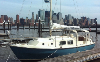 The Freedom Tower was still under construction when Roger’s son Justin took this photo of Bucket from Newport, New Jersey, with the Manhattan skyline in the background. Bucket is a Westerly Chieftain.