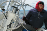 Is it that watching telltales gives her a stiff neck or that bundling up to steer the cold Lake Superior breezes — over a life jacket to boot — makes her feel like the Michelin Man? Whatever the reason, Karen doesn’t take well to the helm.