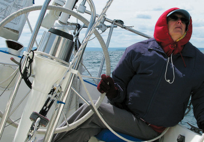 Is it that watching telltales gives her a stiff neck or that bundling up to steer the cold Lake Superior breezes — over a life jacket to boot — makes her feel like the Michelin Man? Whatever the reason, Karen doesn’t take well to the helm.