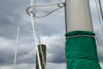 Tom’s halyards clip into a carabiner welded into his Halyard Handler.