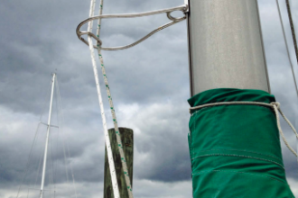 Tom’s halyards clip into a carabiner welded into his Halyard Handler.
