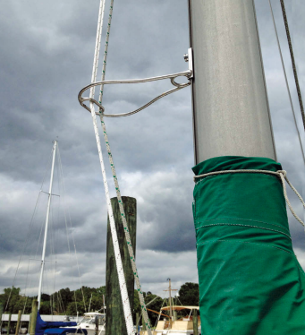 Tom’s halyards clip into a carabiner welded into his Halyard Handler.