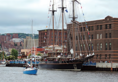 The barquentine Peacemaker welcomes adoring visitors on land and in small ships. She has a sparred length of 140 feet and a rig height of 123 feet. Read about her at peacemakermarine.com.